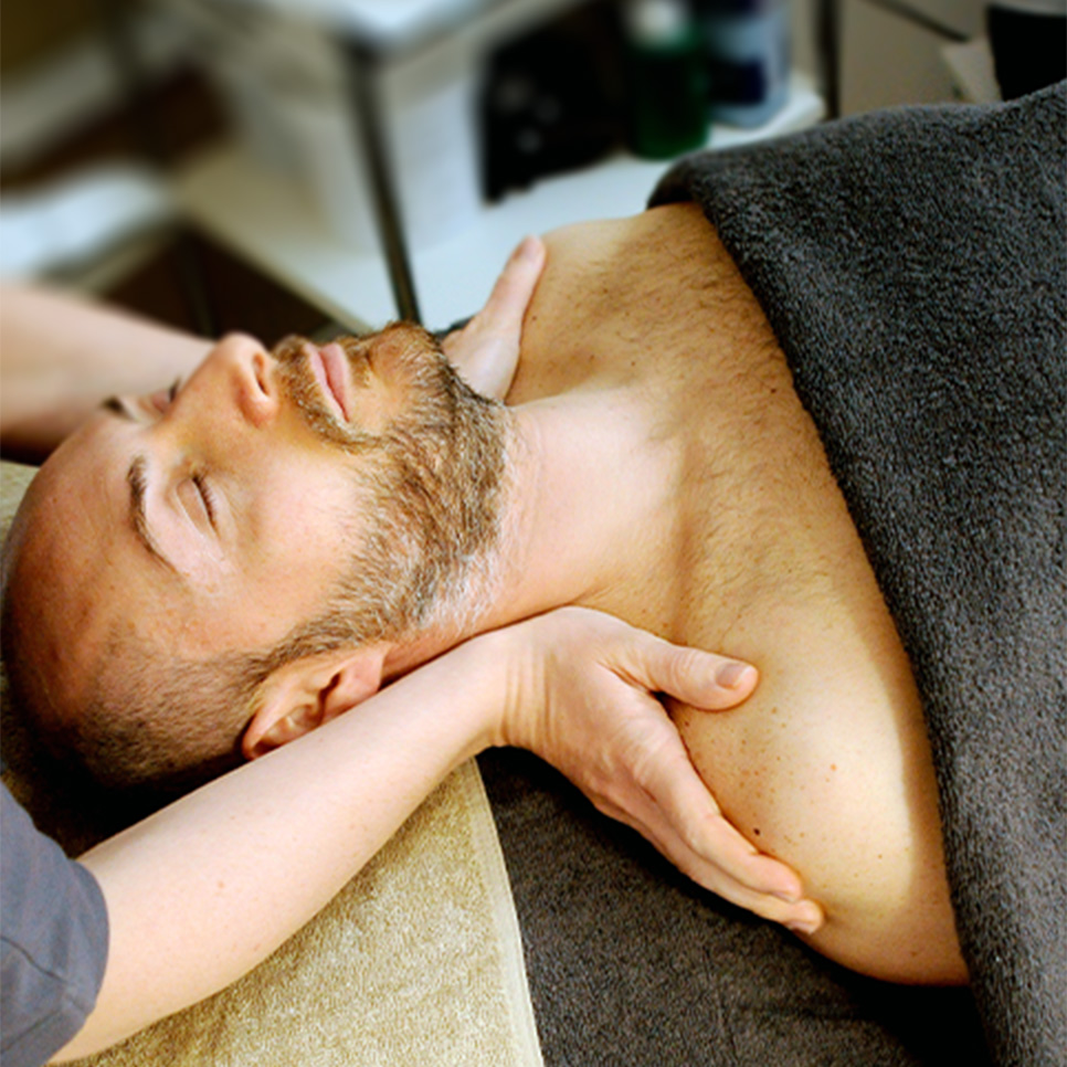 man receiving massage therapy